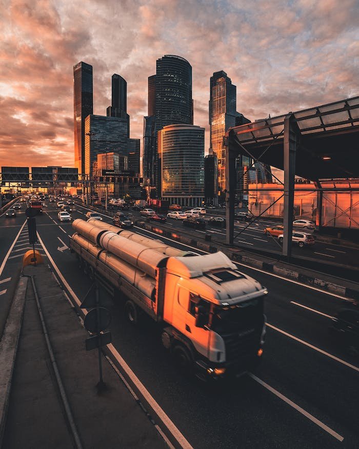 A stunning vertical shot of Moscows skyline at sunset with traffic below, highlighting urban life and architecture.